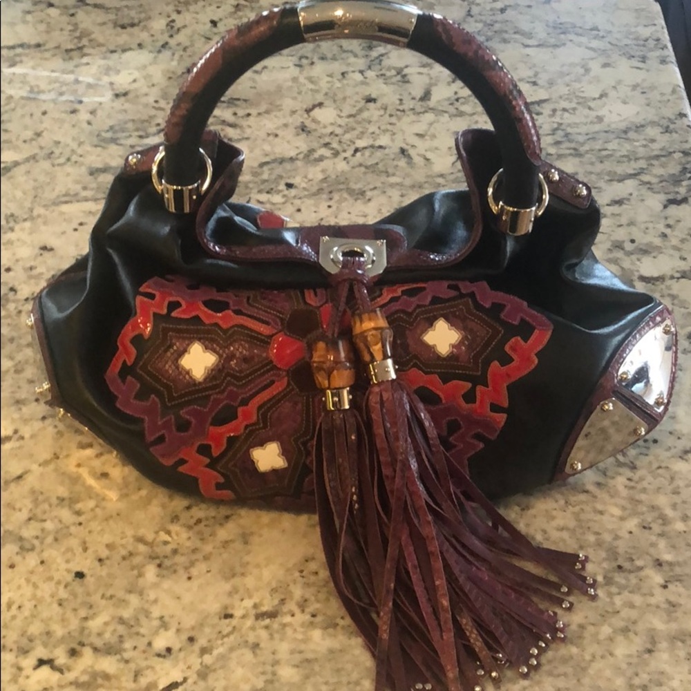 Gucci bag with python and purple tassels